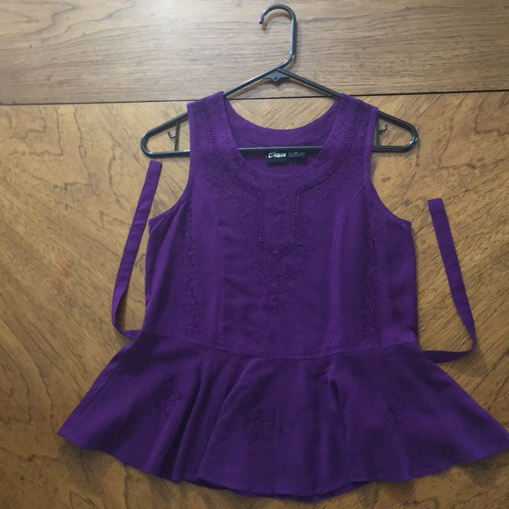 True purple peplum-style sleeveless blouse